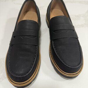 Black loafers tan trim